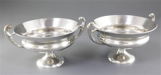 A pair of Edwardian Art Nouveau silver two handled pedestal bowls,
